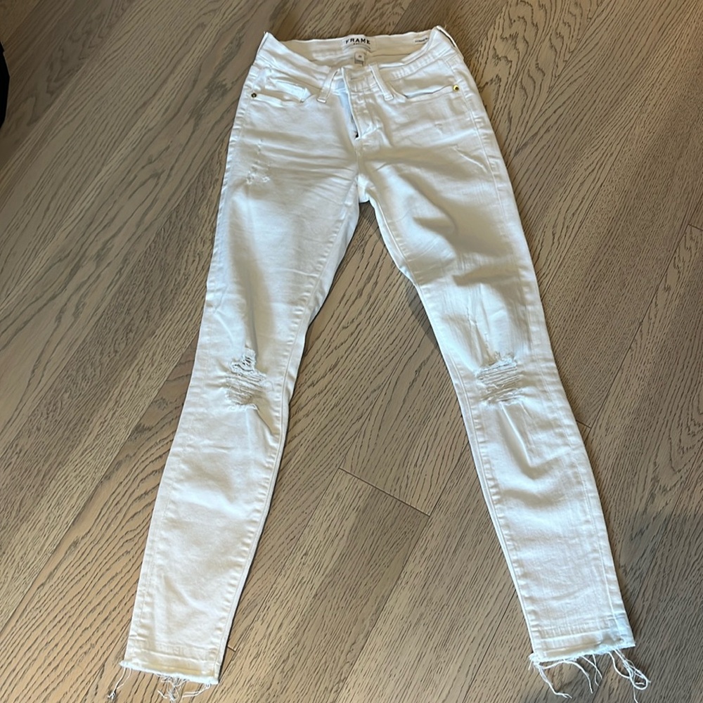 Frame lightly distressed white jeans